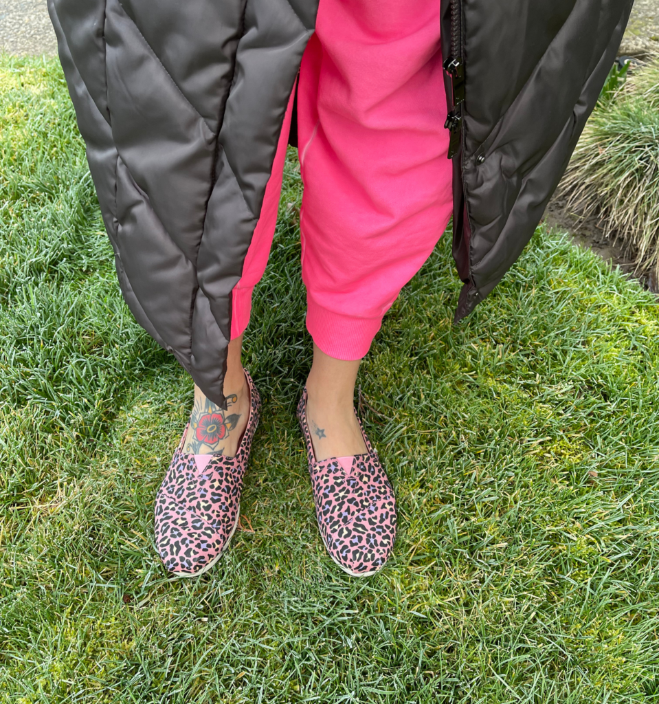 Natalie with pink sweatpants and zebra print shoes